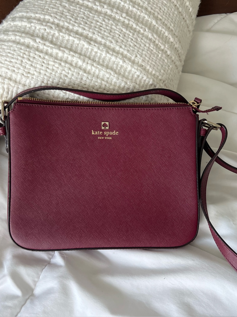 kate spade wine red crossbody with gold-tone logo